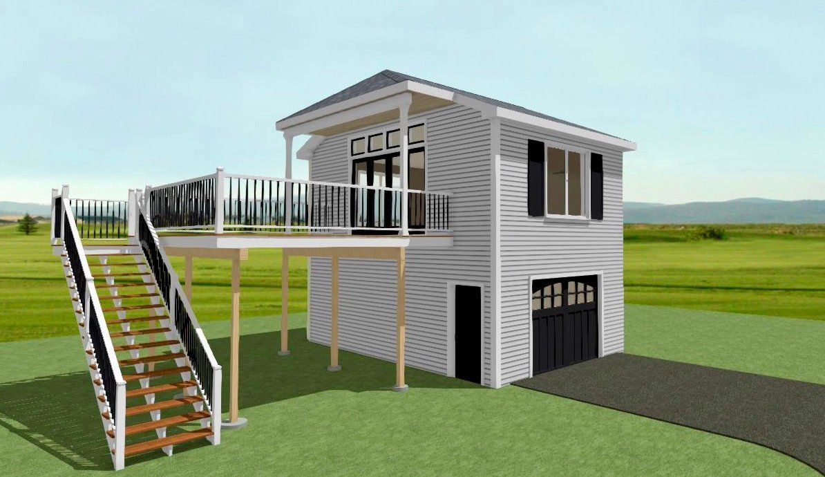 Modern elevated house with stairs, deck, and garage in a grassy field under clear sky