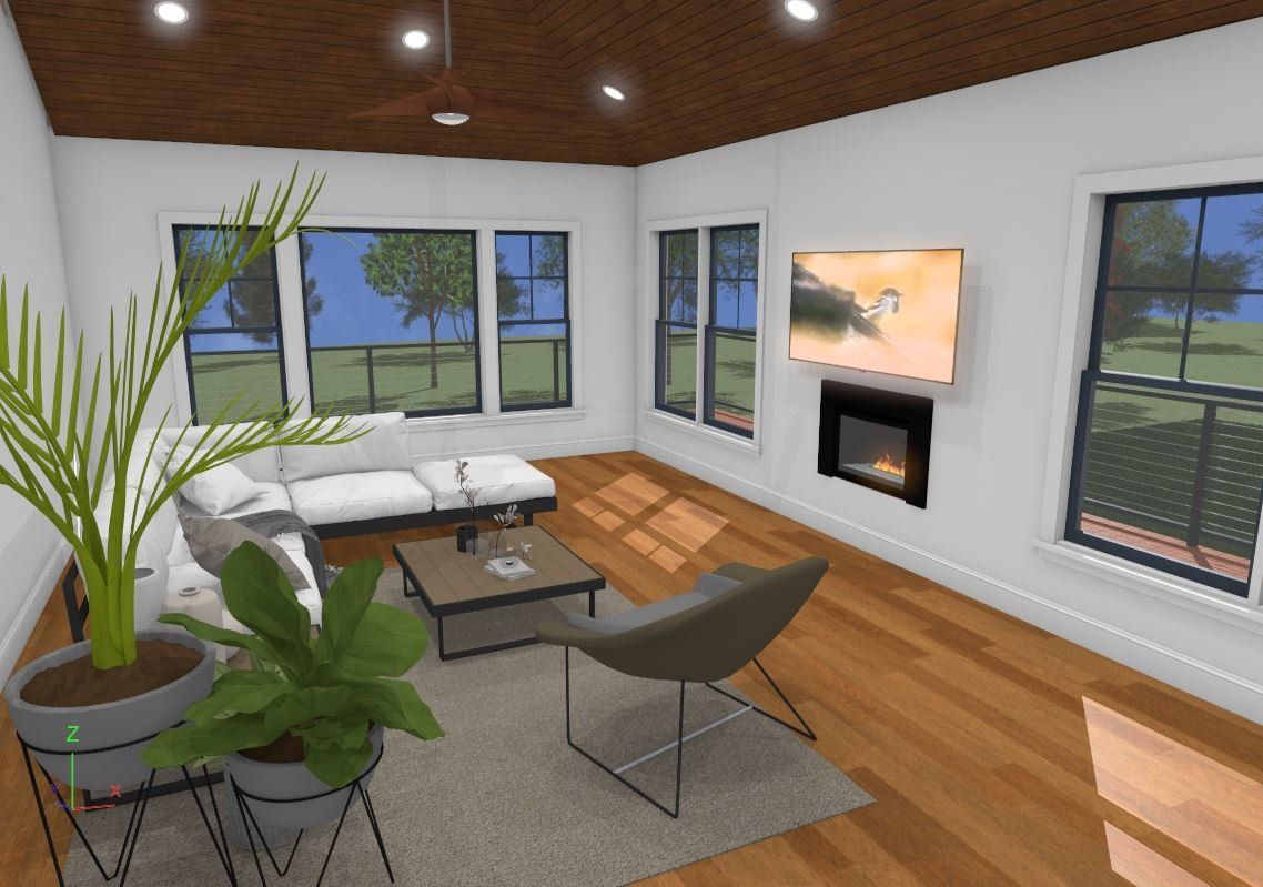 Modern living room with white sectional, plant, large windows, wood floor, and a wall fireplace in daylight