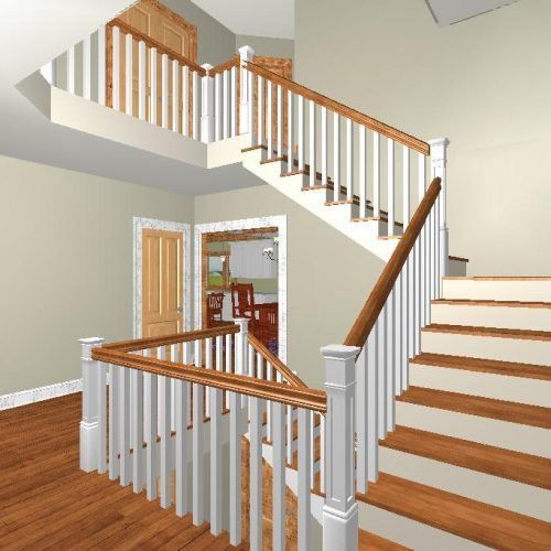 Interior staircase with white balusters, wood handrails, and hardwood floors in a beige home.