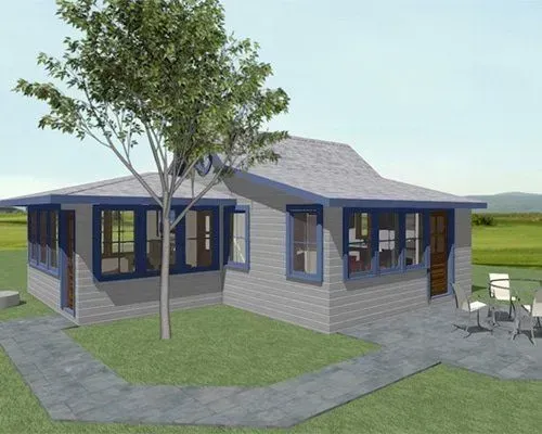 Modern gray house with blue trim, large tree in front, and patio furniture on a grassy lot.
