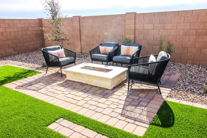 Back Yard Conversation Area With Four Wicker Chairs