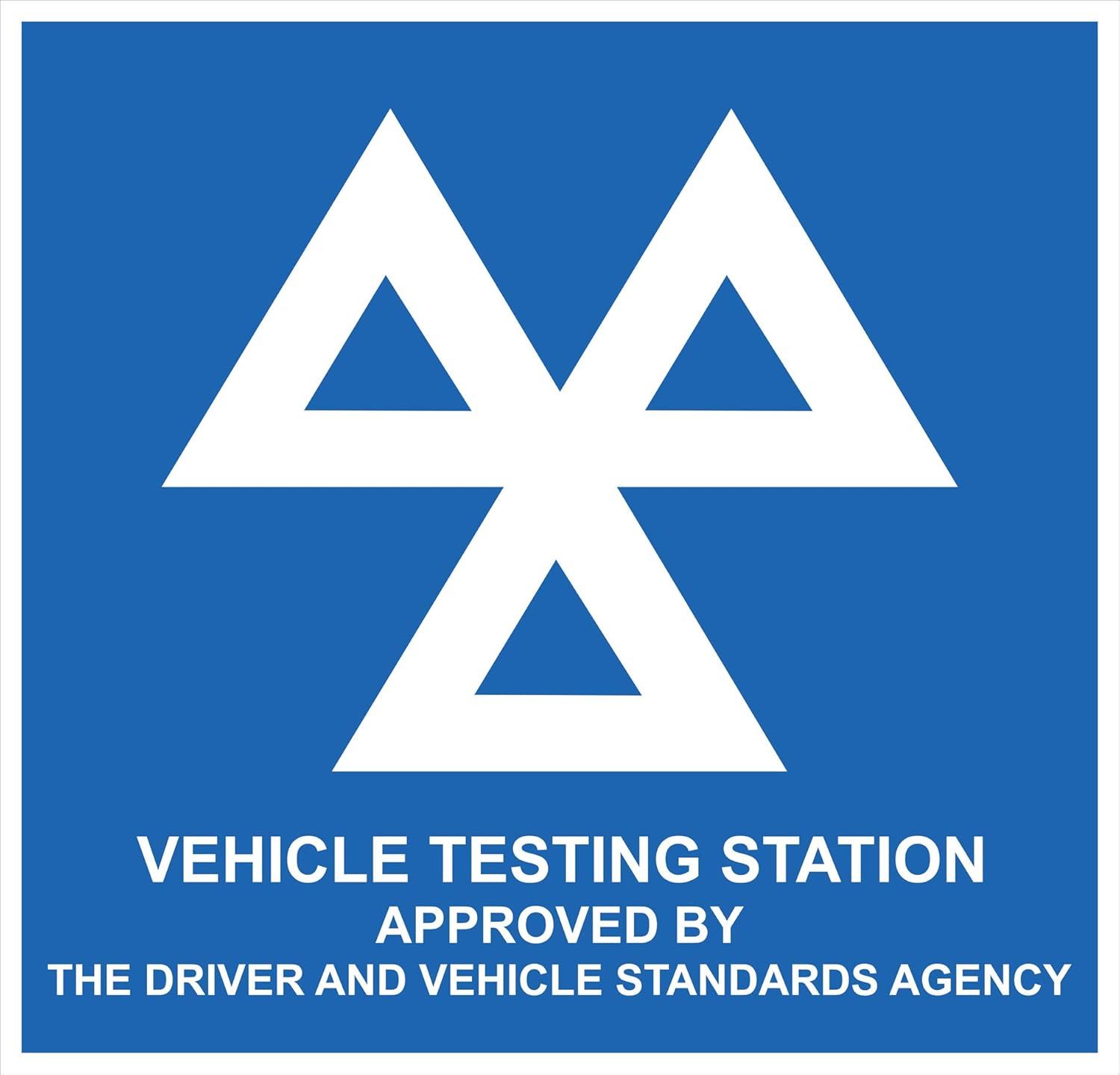 Blue vehicle testing station sign with white logo and text for the Driver and Vehicle Standards Agency