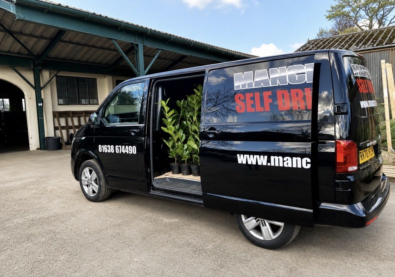 Black van with open side door van hire by Manchetts 