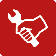 White hand holding a wrench on a red square background, indicating repair or maintenance