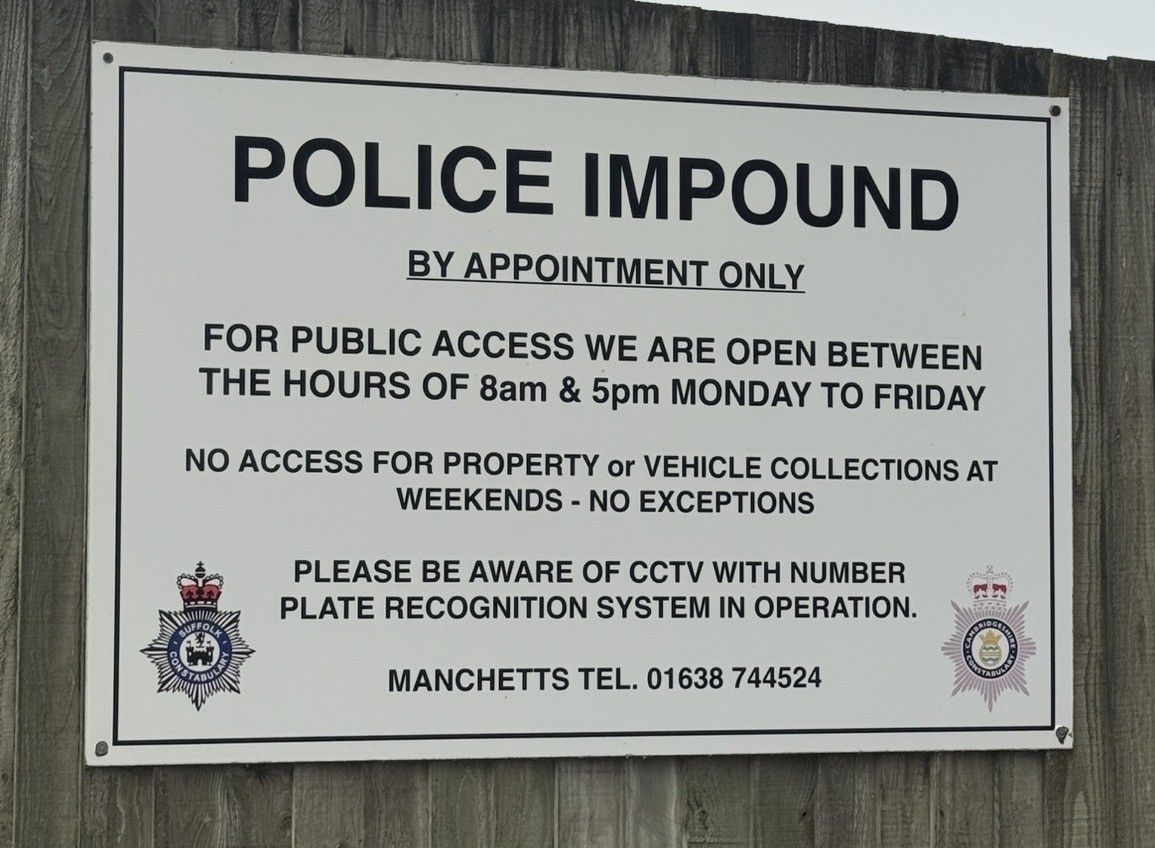 Police impound notice sign with hours, no public access weekends, and warning about CCTV and number plate recognition.