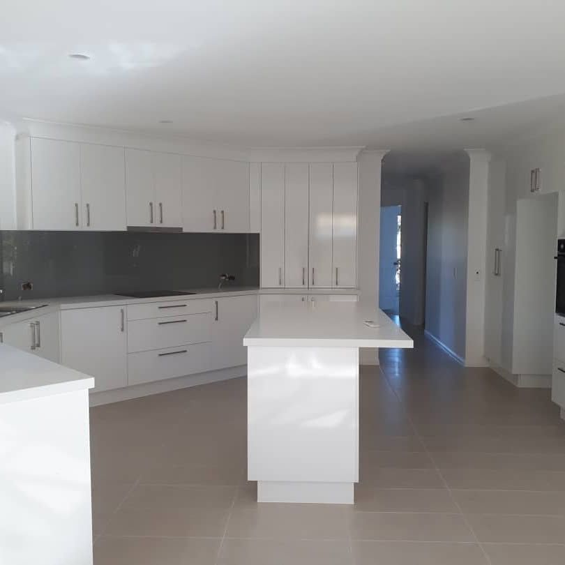 A Kitchen With White Cabinets — Pottsville Carpentry and Home Maintenance In Pottsville, NSW