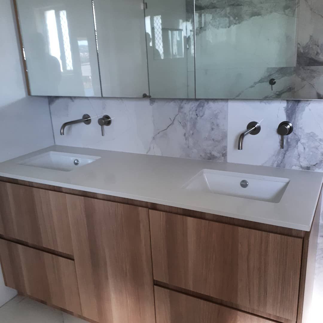 A Bathroom With Two Sinks And A Mirror — Pottsville Carpentry and Home Maintenance In Pottsville, NSW