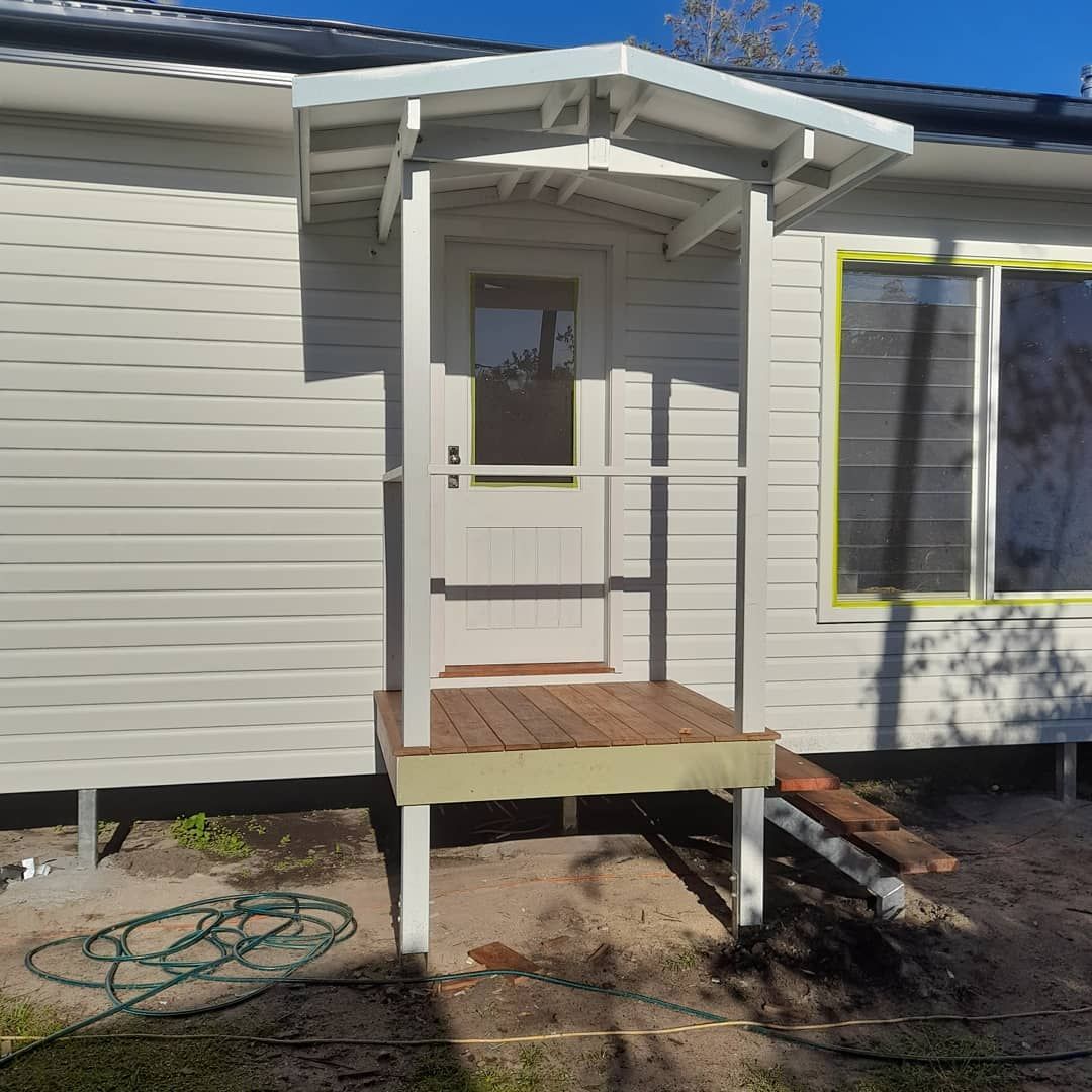 A White House With A Porch And A Window — Pottsville Carpentry and Home Maintenance In Pottsville, NSW