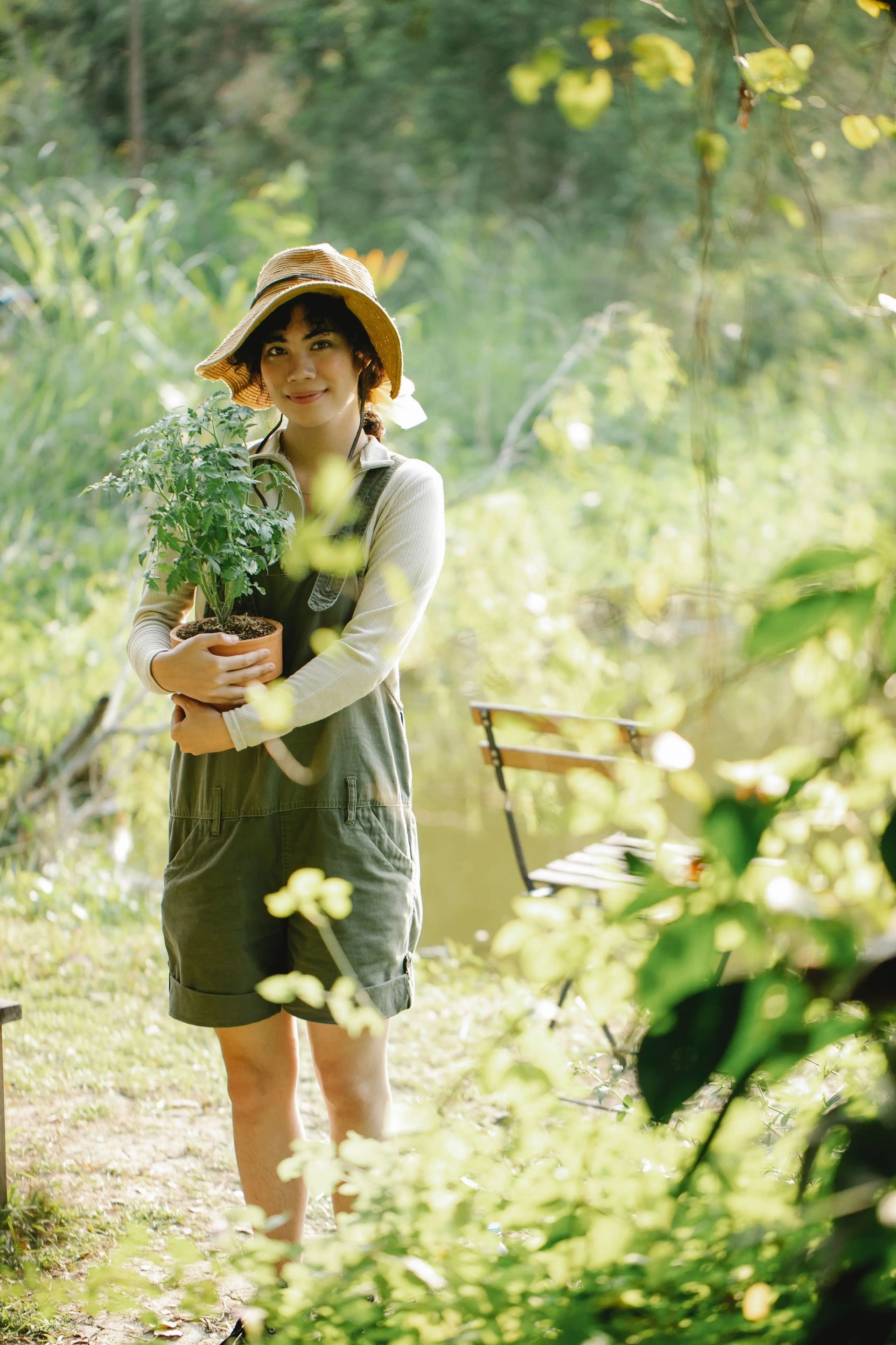 Woman Holding Plant