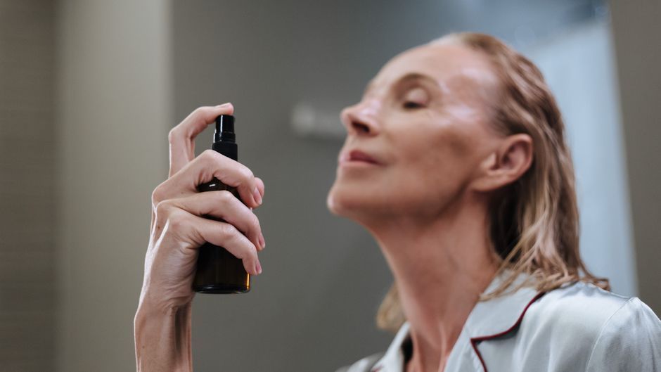 Mature woman checking sun spots and age spots before treatment in Seoul
