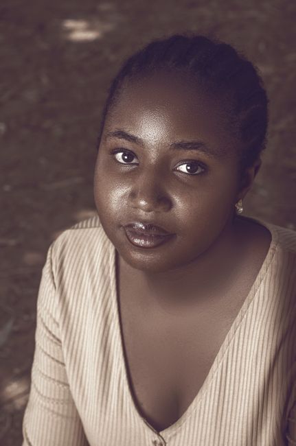 Woman with darker skin tone considering laser treatment in Seoul