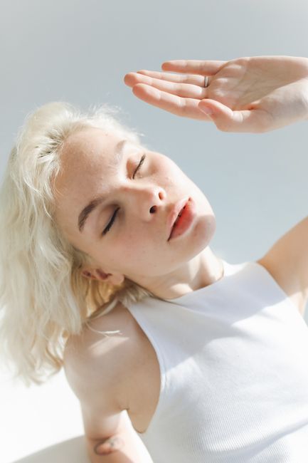 Woman with clearer skin after post-acne marks treatment in Seoul