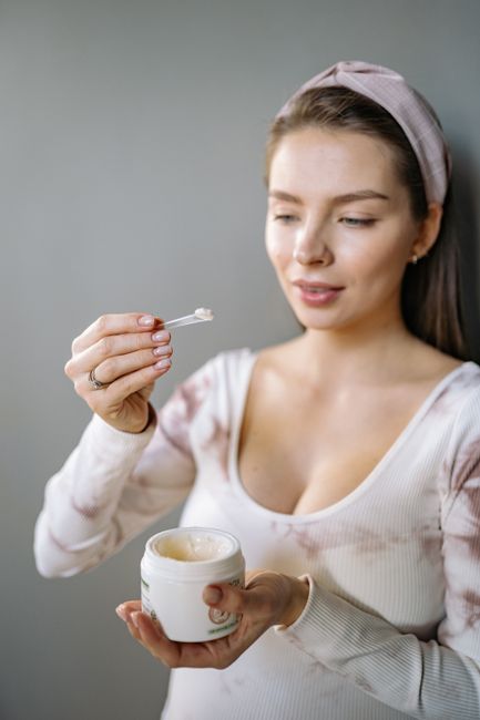 Woman applying a gentle cream to sensitive skin in Seoul