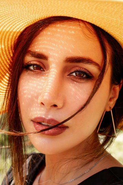Woman protecting skin from sun during pico laser melasma treatment in Seoul