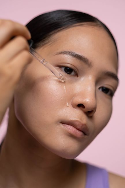 Woman with dewy Korean glass skin glow after skin booster treatment in Seoul