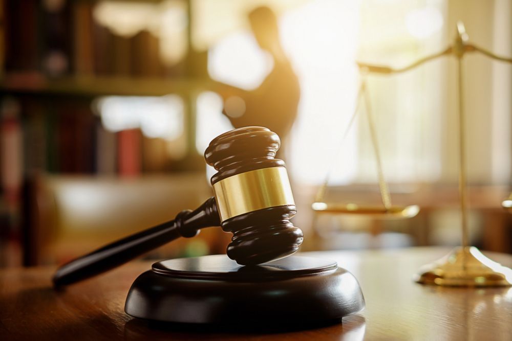 Judge Gavel With Lawyer in the Background