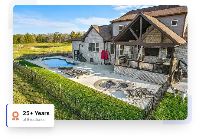 Modern house with a backyard pool, patio seating, and an 