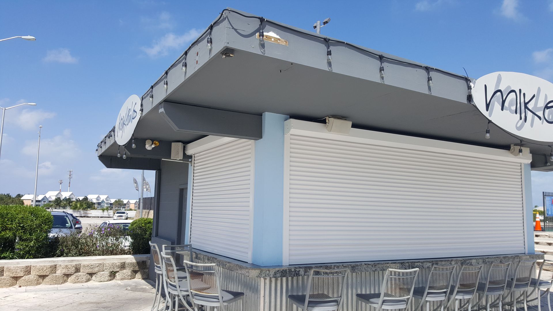 A small building with a sign that says mike on it