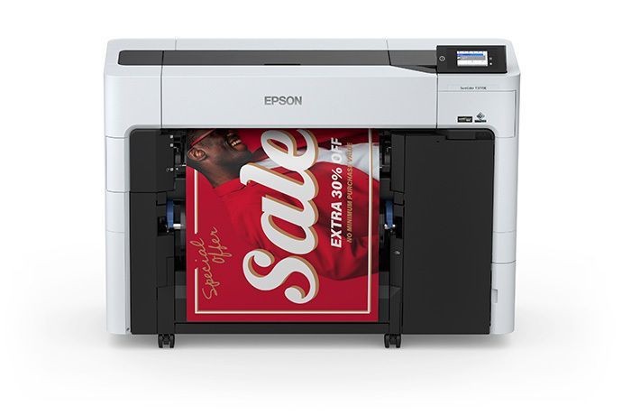 Epson wide-format printer printing a red sale poster with white lettering