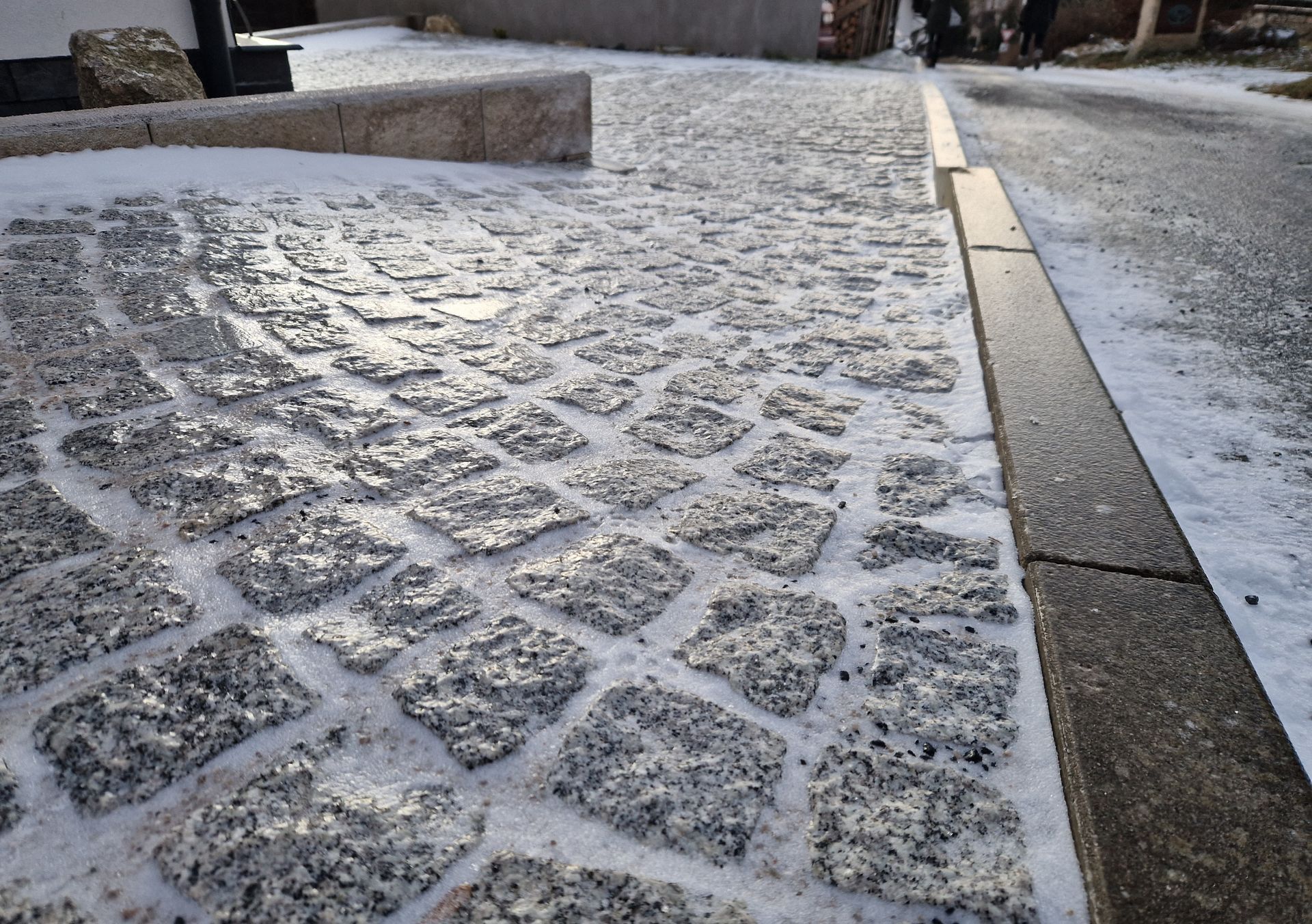 Decorative Concrete Patios with a stamped cobblestone-pattern finish
