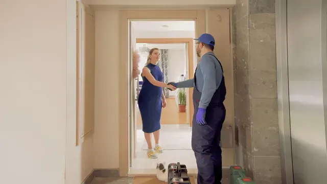 Repairman shaking hands.