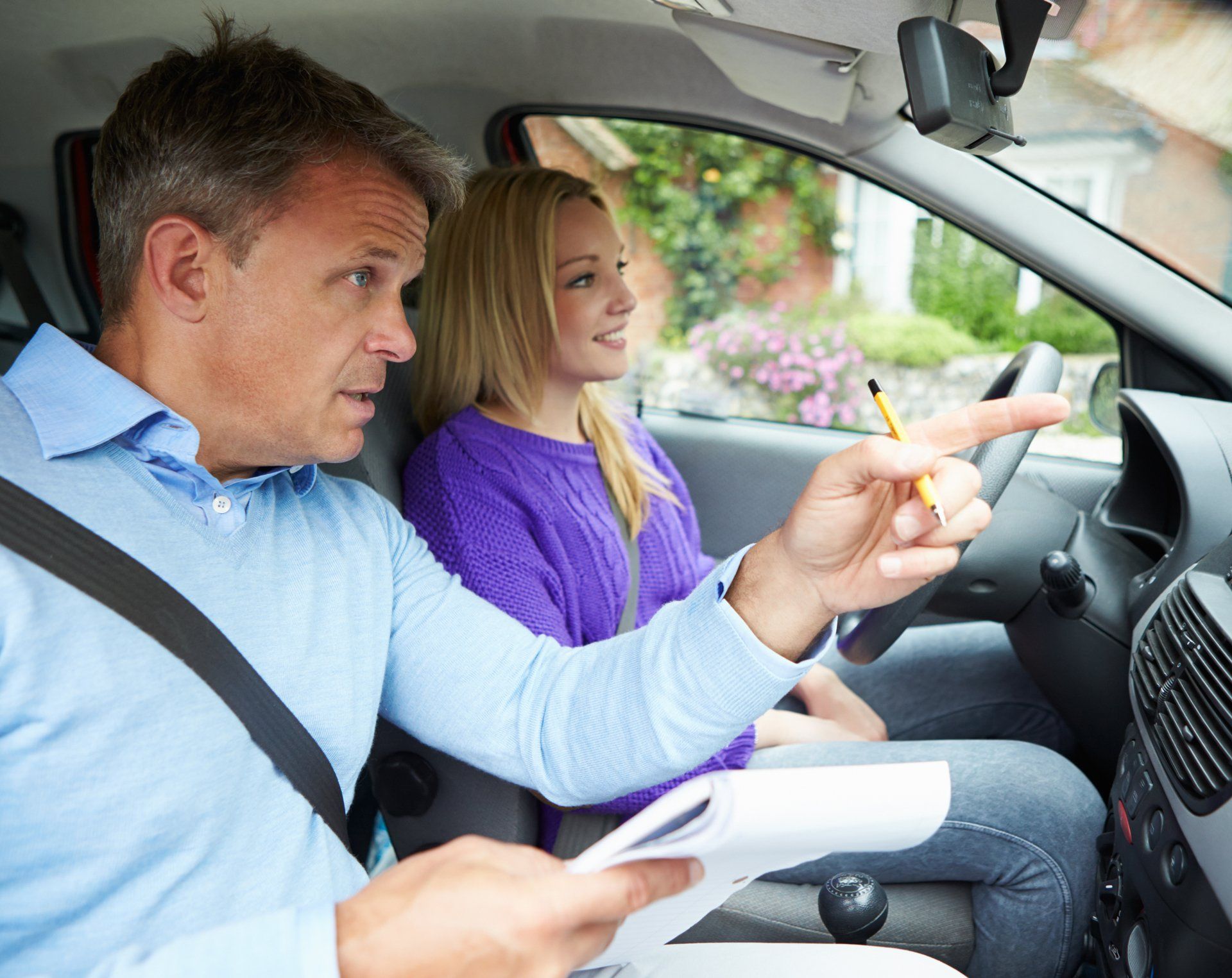 Professional Driving Instructor Explaining Driving Course