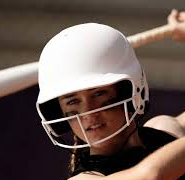 Smiling person wearing a white helmet and face guard, close-up in a sports setting
