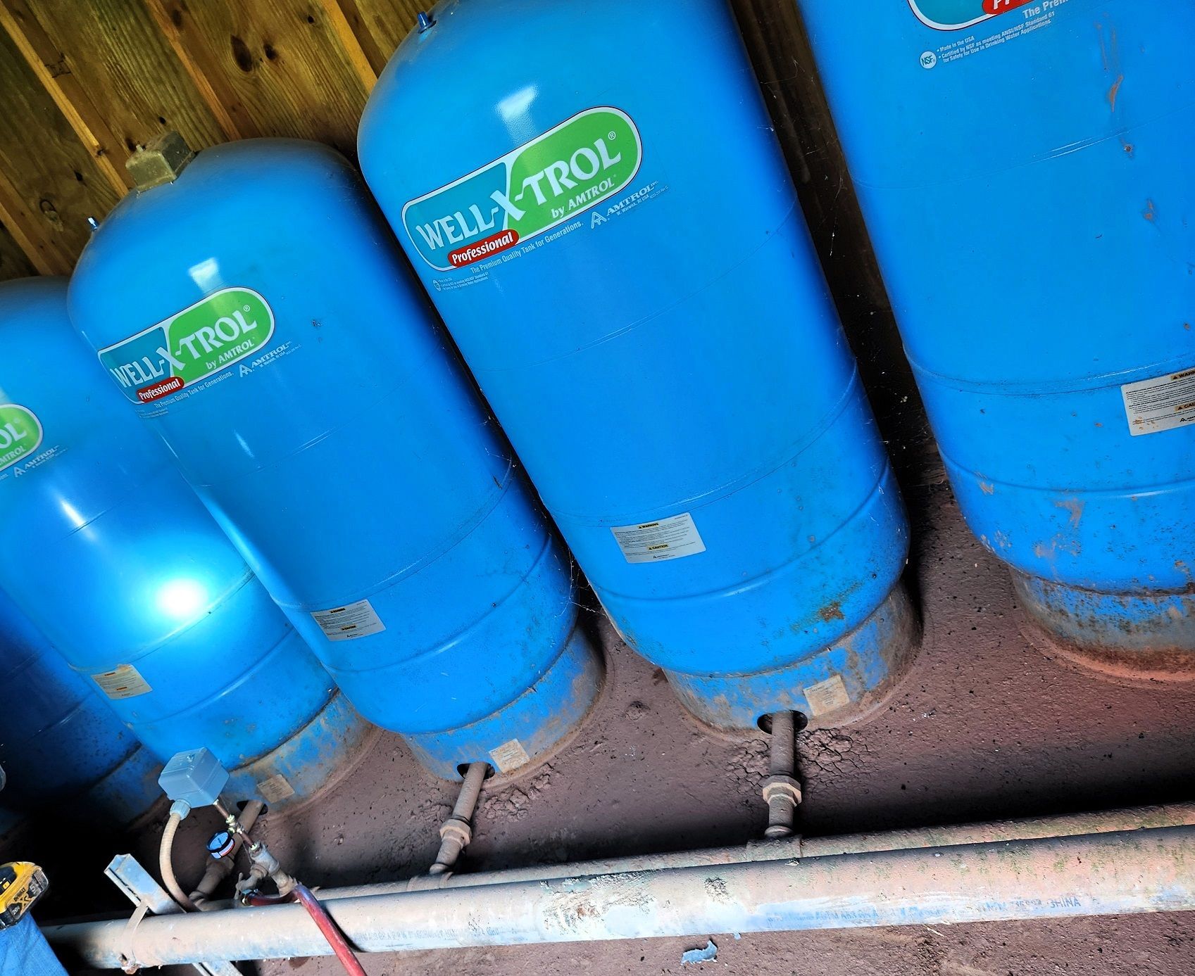 A blue water tank with the word challenge on it