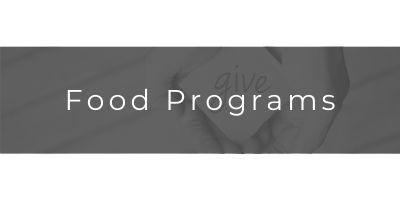 Food Programs title over a gray banner with faint hand imagery