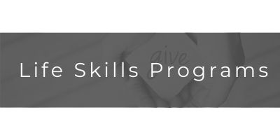 Text banner reading “Life Skills Programs” on a gray background.