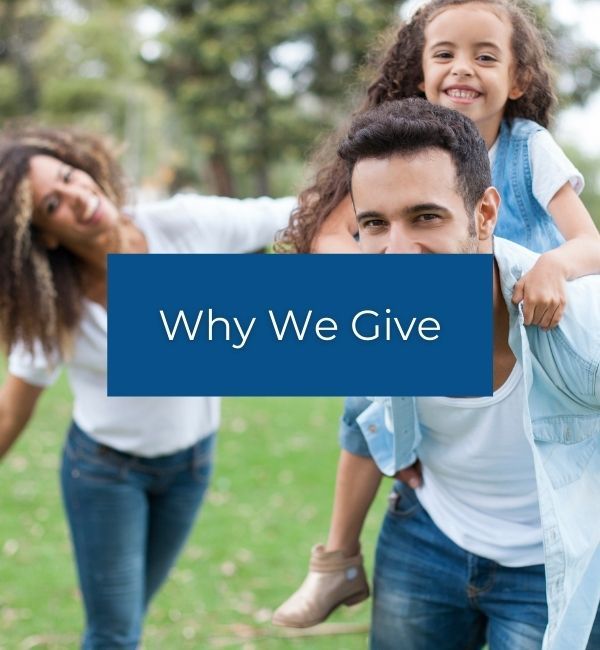 Smiling family outdoors with a blue banner reading “Why We Give”