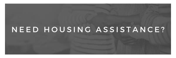 Banner reading “Need housing assistance?” on a gray background
