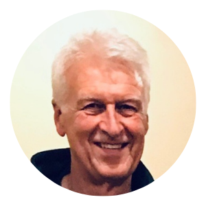 Smiling white-haired man in a circular portrait on a light background