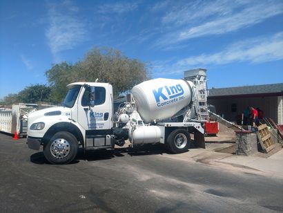 King Concrete single-axle truck delivering a small batch concrete order to a residential property in the East Valley