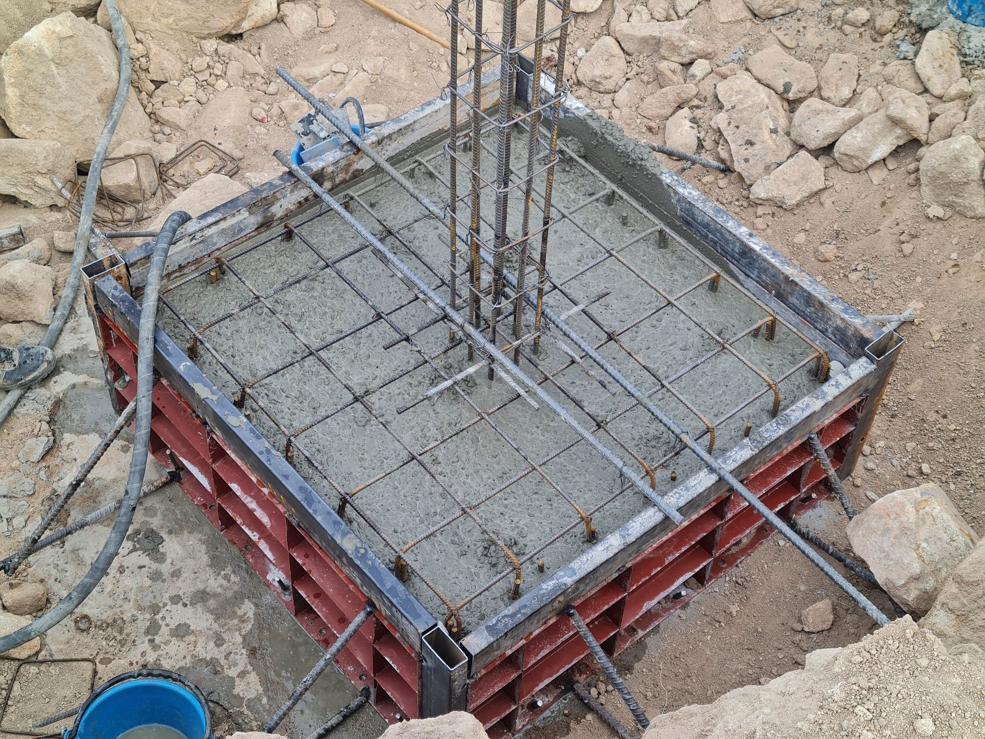 Residential footing forms filled with fresh concrete, rebar visible, Chandler, AZ East Valley