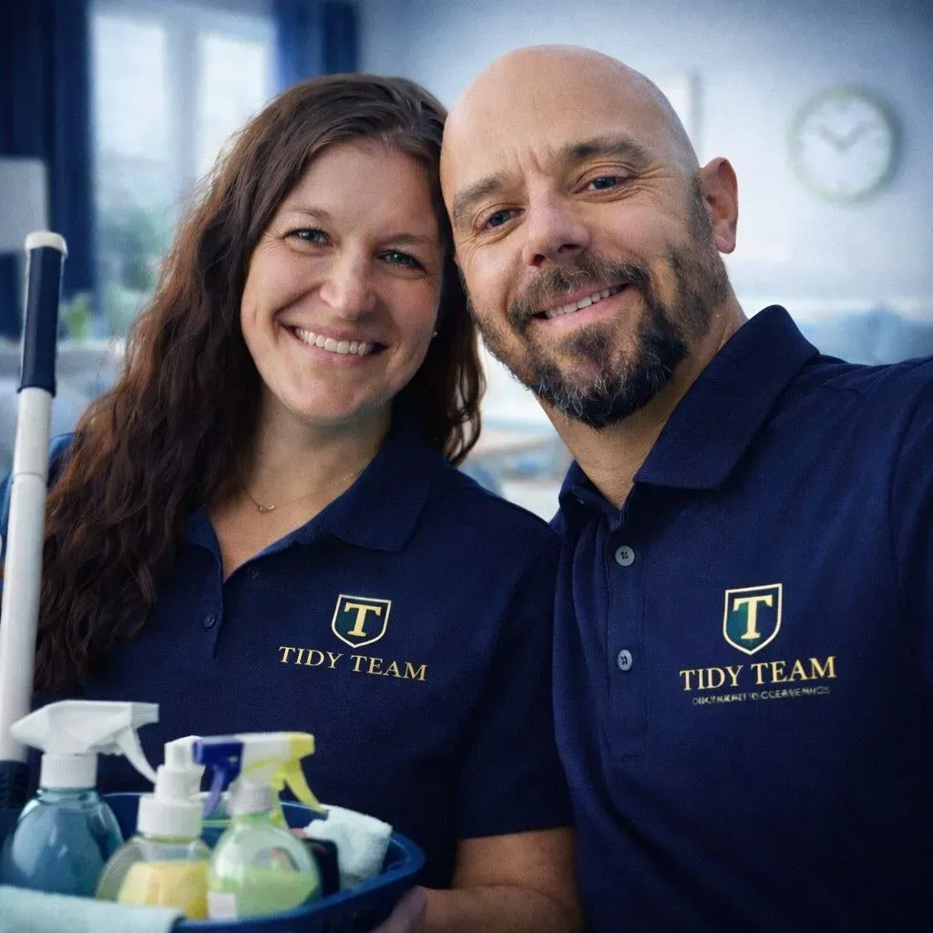 Two people wearing navy polo shirts with 