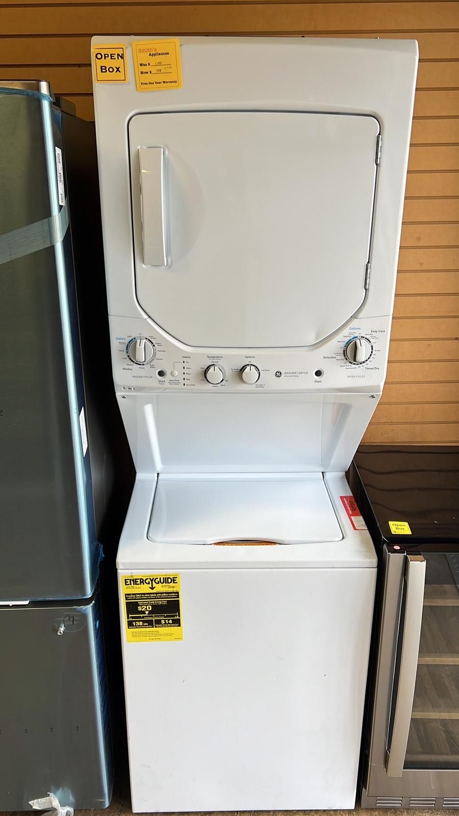 A white washer and dryer are stacked on top of each other.