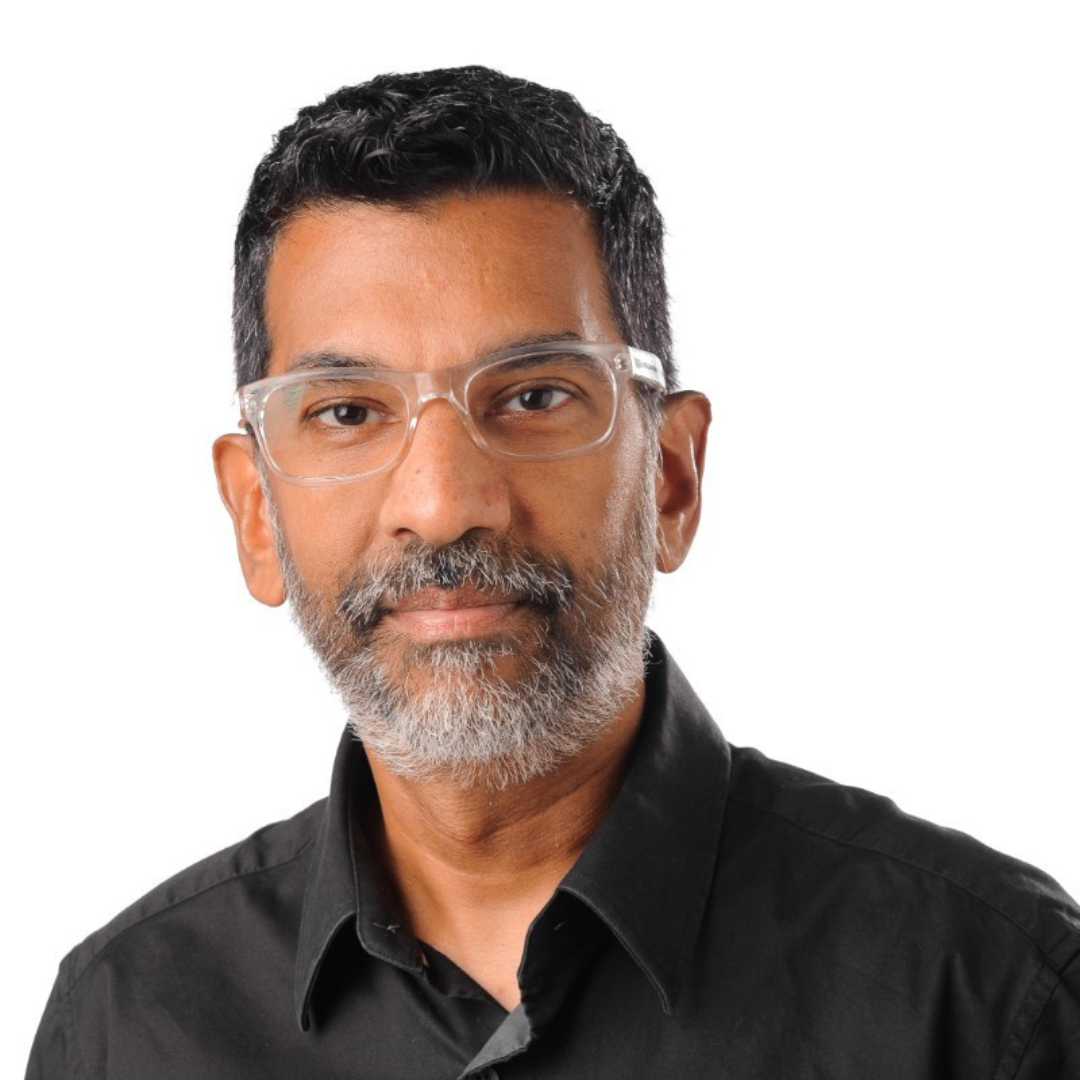 A man with glasses and a beard is wearing a black shirt