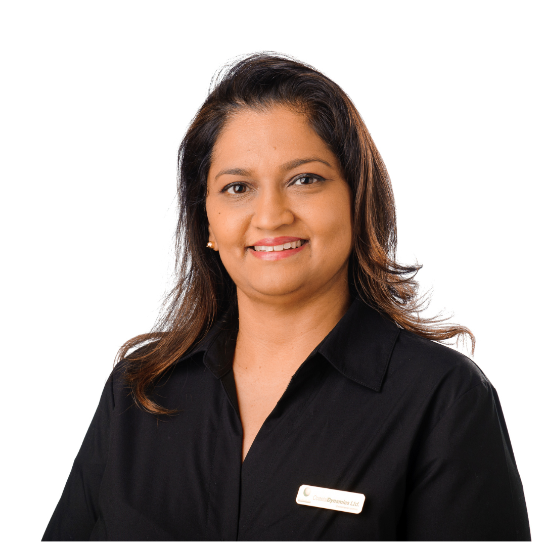 A woman is wearing a black shirt and smiling for the camera.