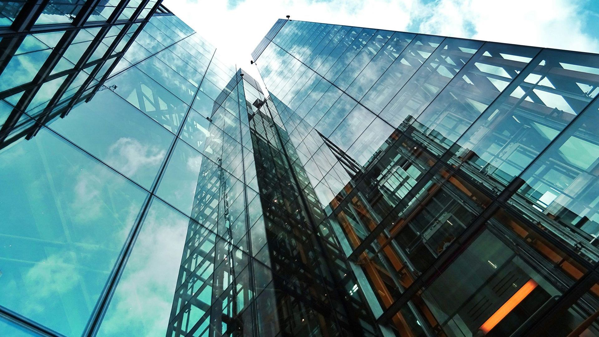 Looking up at a tall building with a lot of windows.