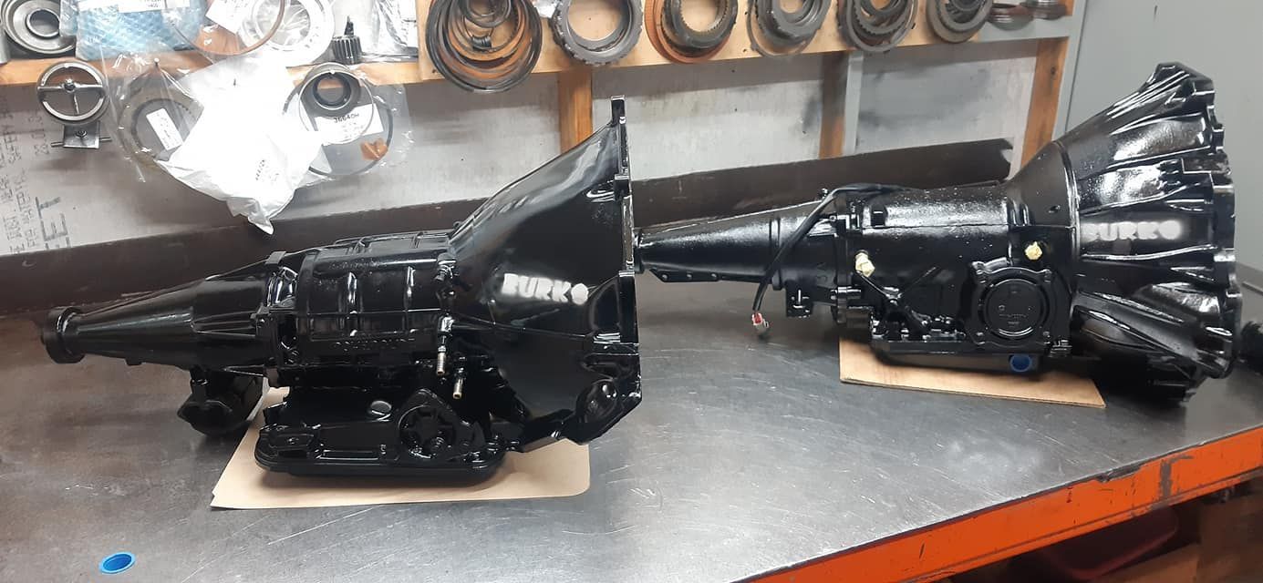 Two Black Transmissions Are Sitting on a Table in a Garage — Burko Transmissions in Benalla, VIC