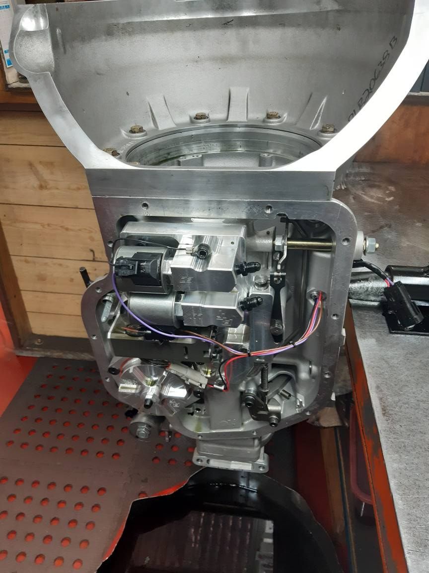 A Boat Motor is Sitting on a Table With the Cover Removed — Burko Transmissions in Shepparton, VIC