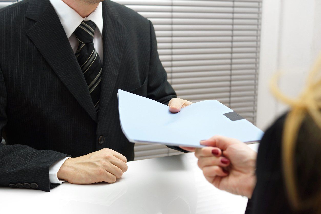 man giving papers