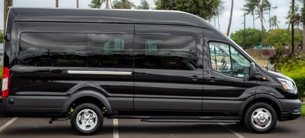 Black passenger van parked outdoors.