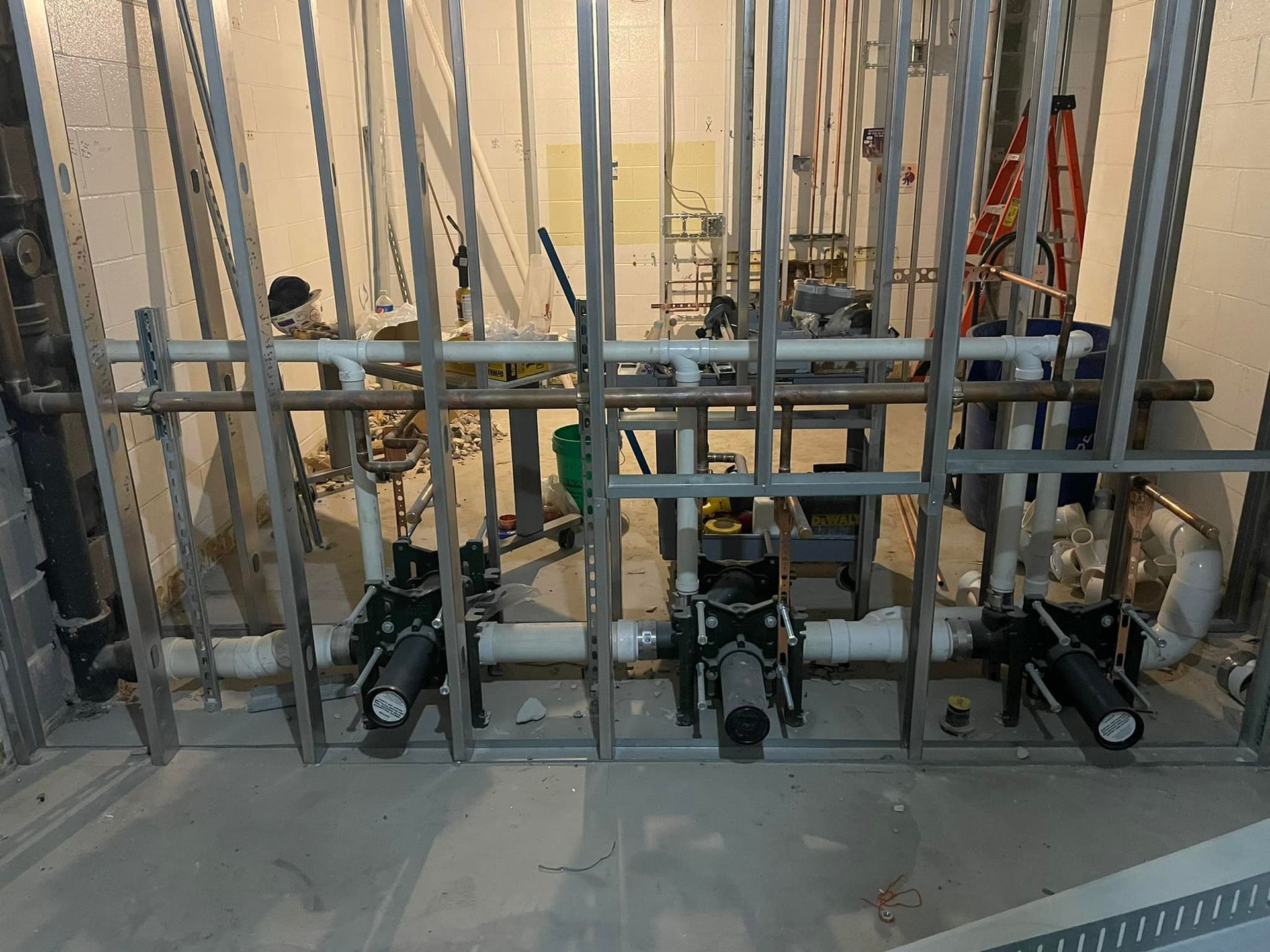 A room with a lot of pipes going through it.