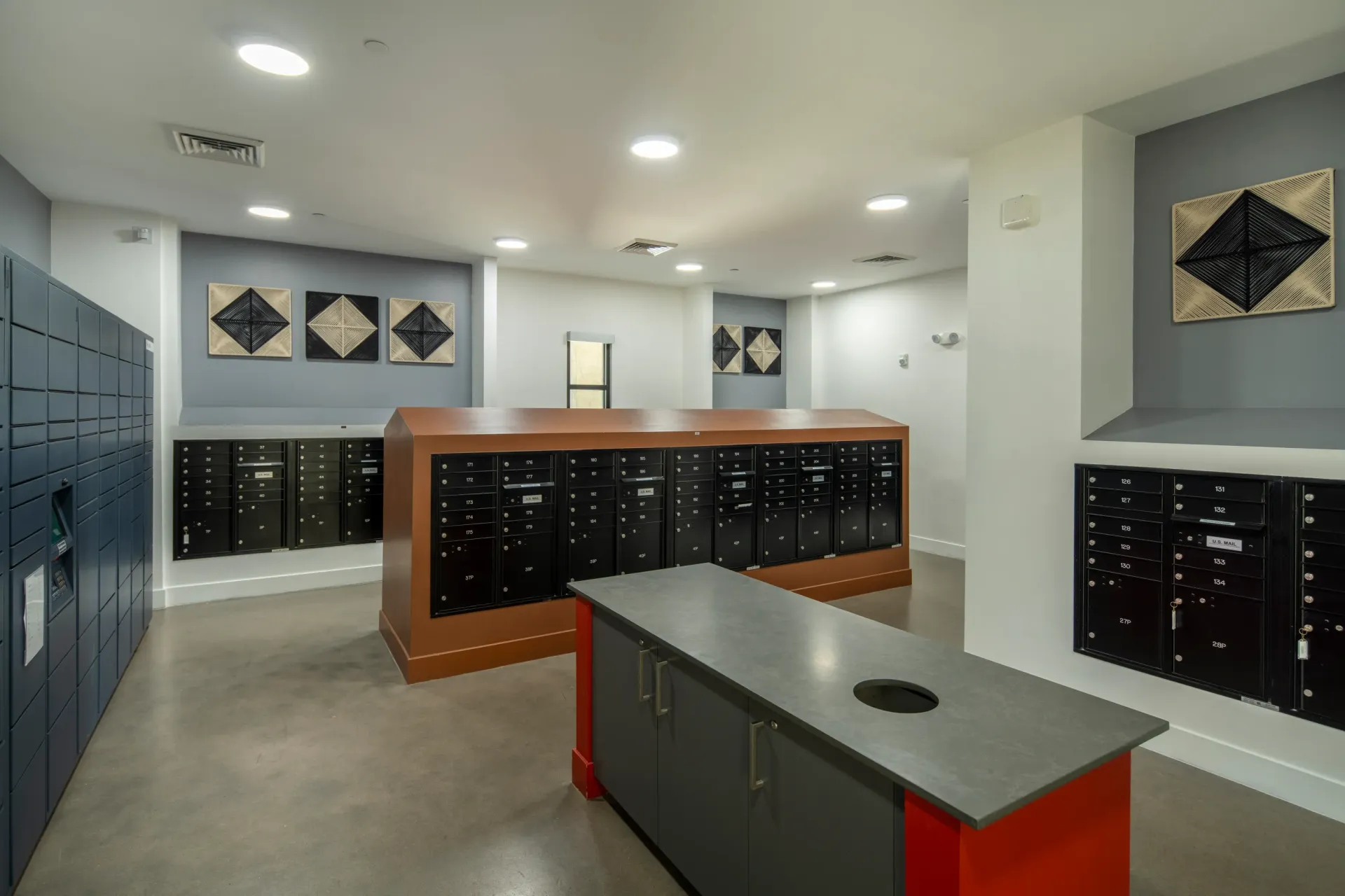 Mailroom with mailboxes and package lockers at Parc Lofts in Tolleson, AZ.