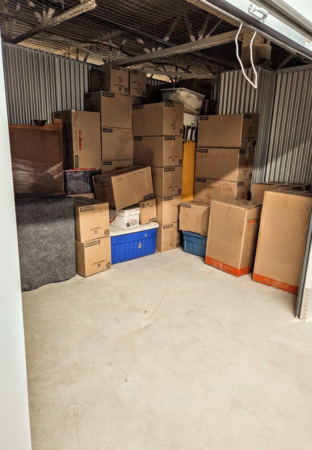A storage room filled with lots of cardboard boxes.