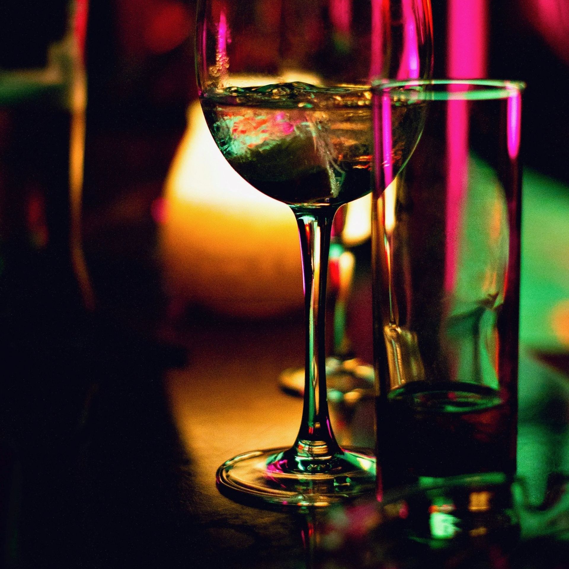 Glasses with luxury lighting in the bakground.