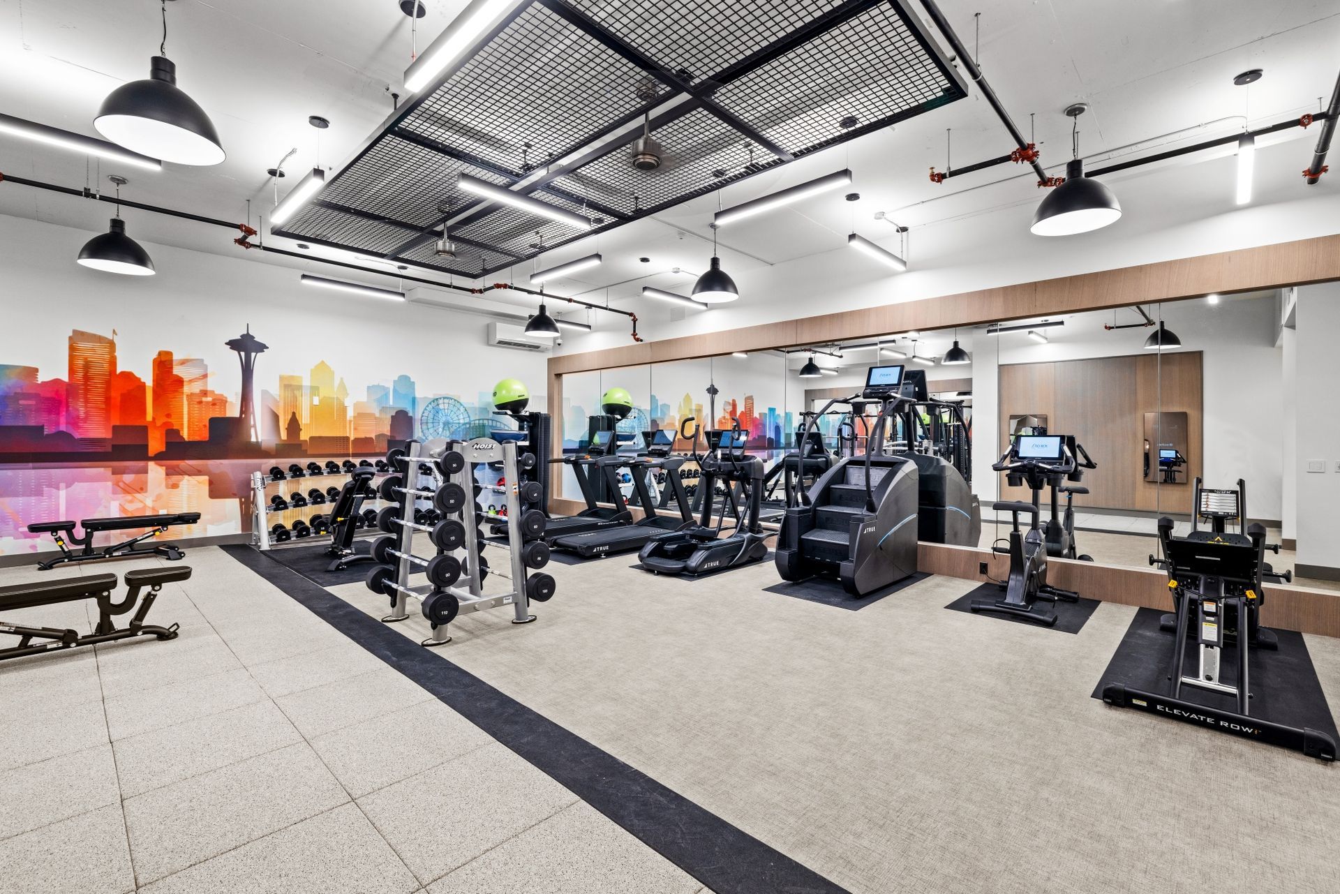 An artist's impression of a gym with treadmills and a large mirror.