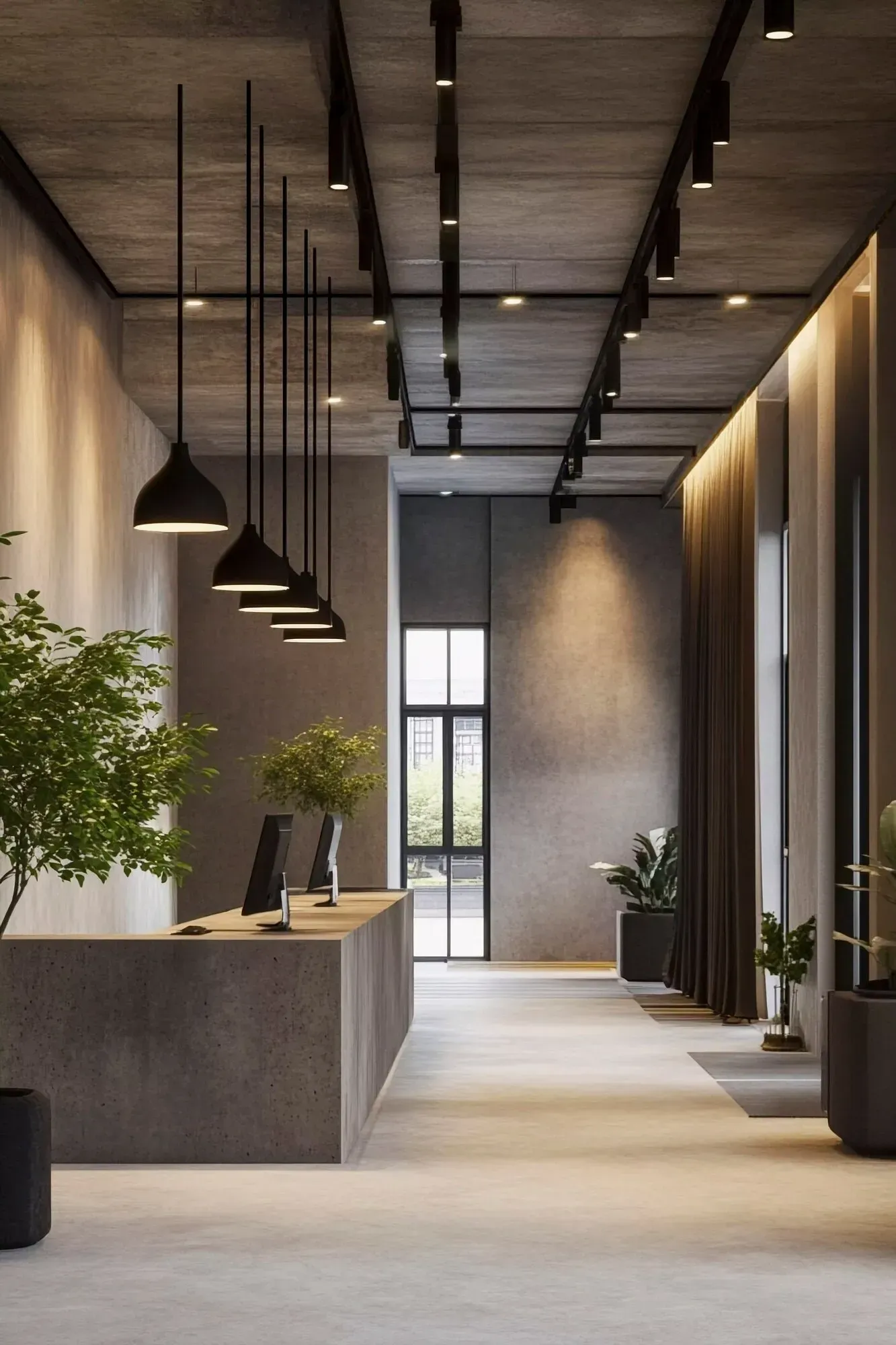 Modern office lobby with concrete counter, hanging pendant lights, plants, and warm wood accents